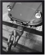 Poster Master Woman Under Classic Car Poster by PosterMaster