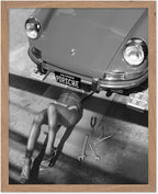 Poster Master Woman Under Classic Car Poster by PosterMaster